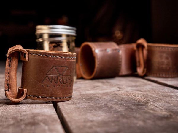 Leather mason cup sleeve with Akribis Leather tool belt logo