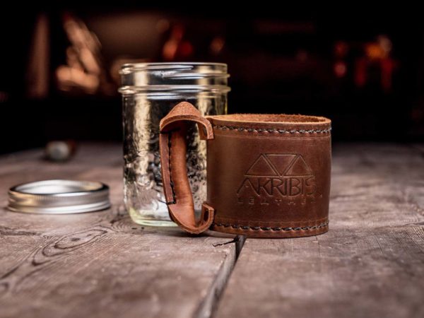 Leather mason cup sleeve with Akribis Leather tool belt logo